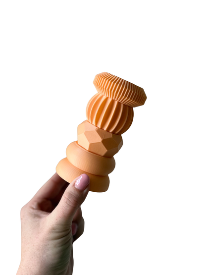 Stapelbare kandelaar basis kleur perzik voorbeeld.